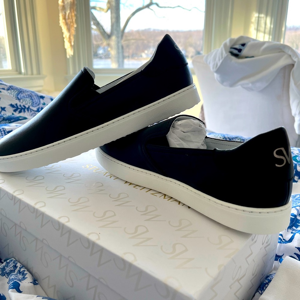 Stuart Weitzman. Never worn slip on sneakers.